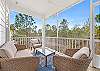 This just might be your most favorite space of the cottage. Enjoy being outdoors without battling the elements in this cozy screened porch which features comfortable seating.