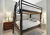 The guest bedroom features a Queen over Queen  bunk bed that is capable of sleeping 4 comfortably. 
