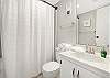 The guest bathroom offers a tub/shower combo, single vanity, and is fully stocked with linens for your stay.