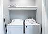 A laundry area is located in the kitchen and offers a full size washer and dryer for convenience