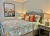 Guest Bedroom 1 offers Queen Bedding, Bedside Tables with Lamps and is Beautifully Decorated.