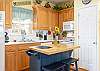 Preparing meals is a breeze in this adorable, fully stocked kitchen. 