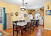 The open kitchen/dining area offers a great space to spend quality time together while preparing meals. 