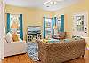 This cute cottage provides the perfect living area for relaxing in your down time. Plenty of seating is featured with a television for entertainment.