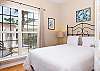 Bedroom 3 is comfortably furnished with queen bedding.