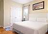 The primary bedroom features luxurious, king bedding. Comfortably furnished to ensure a great night of rest after a long beach day.