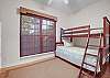 Guest Bedroom 2 offers a twin over full bunk bed and is a perfect space for the kids.