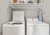 The spacious laundry closet is featured in the kitchen and offers a full size washer and dryer for convenience.