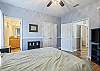 The spacious, primary bedroom features Queen bedding, large closet, and a private bathroom.