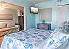 The bedroom offers a comfortable Queen bed, plenty of storage for your personal belongings, and a mounted television for helping you wind down at night.