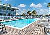 Choose to relax by the pool in one of the loungers, or take a dip in the crystal blue water.