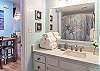 The bathroom offers a single vanity, tub/shower combo, and is fully stocked with linens for your stay.