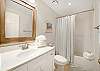 The private bathroom included in Guest Bedroom 2 offers a tub/shower combo, single vanity, and is fully stocked with linens for your stay.