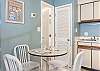 A table with seating for 4 is featured in the kitchen for enjoying meals together or just hanging out.