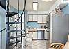 The spacious kitchen features all you need for meal prepping and a table with seating for 4.