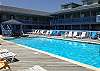 The cove pool is located outdoors on the north side of the building. Large and spacious deck for you to lounge and catch some rays!