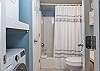 This full bathroom can be accessed privately from the primary bedroom or also accessed from the kitchen. A washer and dryer are provided for convenience of use during your stay.