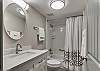 Bathroom offers a tub/shower combo, single vanity and is fully stocked with linens for your stay.