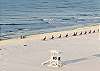 Gorgeous sandy white beach in front of Gulf Tower with a lifeguard tower.