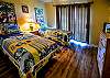 Bedroom 2 offers 2 twin beds and a flat screen television