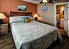 Bedroom 1 features queen bedding and a private bathroom