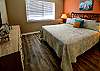 Bedroom 1 features queen bedding