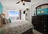 The primary bedroom is located Gulf front and features King bedding and balcony access.