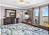 The north bedroom features king bedding, private balcony access, and also a private bathroom. 