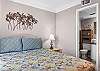The guest bedroom features Queen bedding and a private bathroom.