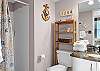 The private bathroom features a standing shower, single vanity, and is fully stocked with linens for your stay.