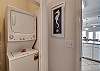 The guest bathroom closet offers a stack washer/dryer for your convenience.
