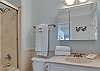 Bathroom 2 offers a single vanity. a tub/shower combo and is fully stocked with linens for your stay