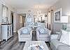 The open living area features plenty of cozy seating and a sofa sleeper for additional overnight guests.