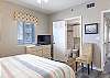 Bedroom 3 features king bedding, private bathroom and a television for winding down at night after a day of fun in the sun.