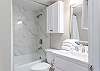 This private bathroom features a tub/shower combo, single vanity, and is fully stocked with linens for your stay.