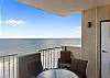Seating is provided on this beach front balcony, which offers endless panoramic views of the Gulf.