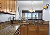 The fully stocked kitchen features stainless appliances and each cabinet and drawer is fully stocked with items needed for preparing your meals during your stay.