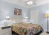 This guest bedroom features Queen bedding, and is furnished with a coastal vibe to make you feel right at home.