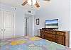 Wind down at night after a long day on the beach watching your favorite television show or movie on the television featured in the primary bedroom.