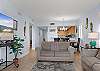 The open living area features comfortable seating including a sofa sleeper for additional, overnight guests.