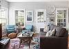 The spacious living area features plenty of comfortable seating for every member of your group.