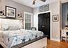 Queen bedding is featured in this guest bedroom and is beautifully furnished to make you feel right at home. Private access to the guest bathroom is also provided with this guest bedroom.