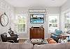 The spacious living area provides plenty of seating and a large television for enjoying your down time.