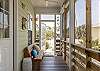 Unit 1101 features a large, screened porch for enjoying time outdoors without having to battle the elements. Seating is provided so you can sit and enjoy nature.