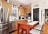 The fully stocked kitchen is perfect for preparing snacks for the beach or a full course meal after a day in the sun.