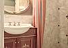 The Garden Suite 1st bathroom has a walk-in shower.