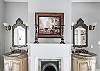 His & Her vanities flank the original (non-functioning) fireplace.