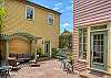 The center courtyard is shared with guests in Main House and the Carriage House. The green door to left is the garage entrance w/your garage parking space. The Carriage House is above w/windows shown.
The door to right is the sunroom of Main House