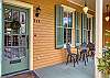 The Main House front porch overlooks the lush Washington Square.