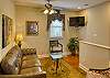 The stairs are on the RIGHT in this photo and lead up to the living room & kitchen.
The living room & both bedrooms have smart TVs with free Wifi. No cable, however, so bring your app passwords!
